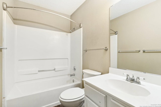 full bathroom featuring shower / bathing tub combination, vanity, a textured ceiling, and toilet