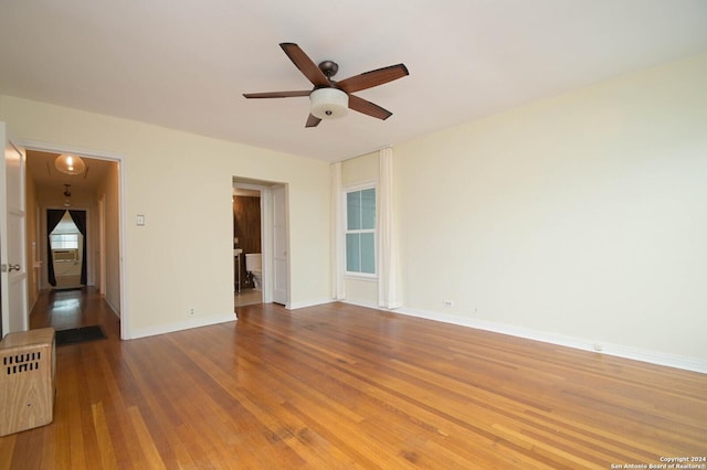 spare room featuring ceiling fan and wood-type flooring