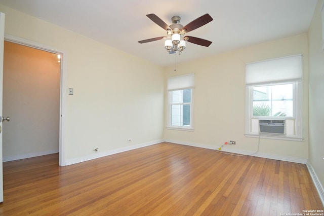 spare room featuring hardwood / wood-style flooring and ceiling fan