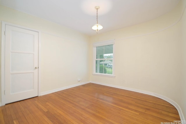 empty room featuring hardwood / wood-style flooring