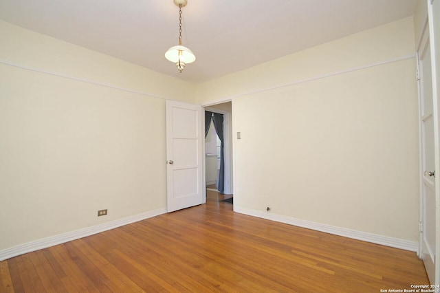 empty room featuring hardwood / wood-style flooring