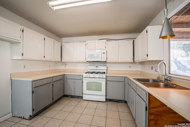 kitchen featuring white cabinets, white appliances, gray cabinets, and sink