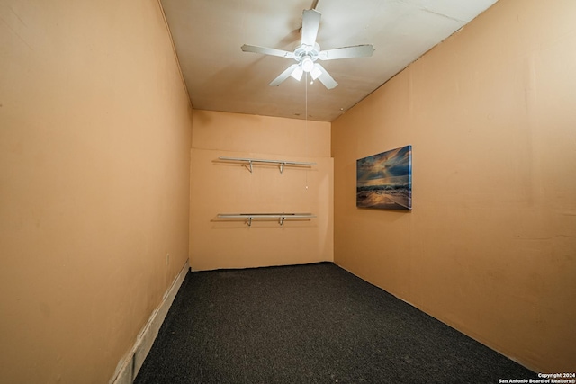 carpeted spare room with ceiling fan