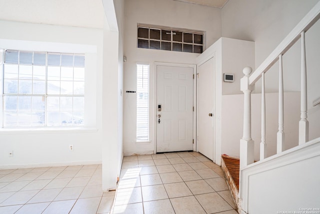 entryway featuring light tile patterned floors