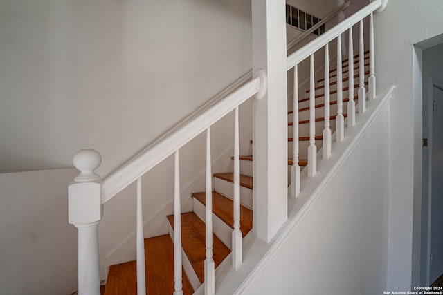 stairway featuring hardwood / wood-style flooring