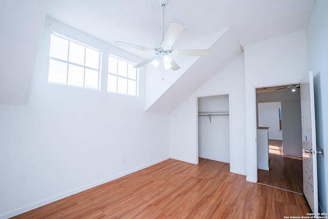 additional living space featuring light hardwood / wood-style floors, ceiling fan, and lofted ceiling