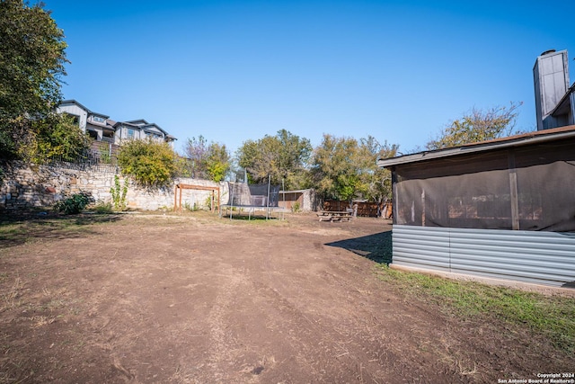 view of yard featuring a trampoline