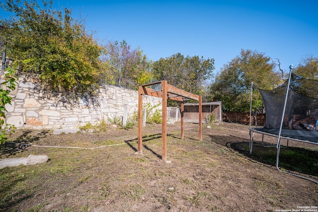 view of yard featuring a trampoline