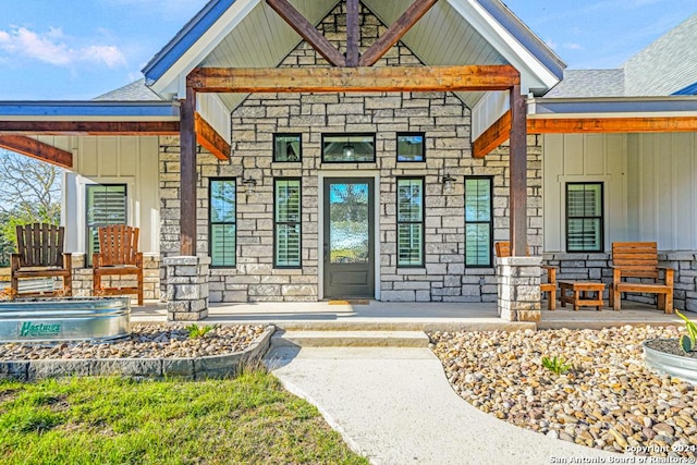 entrance to property with covered porch