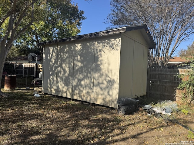 view of property exterior with a shed