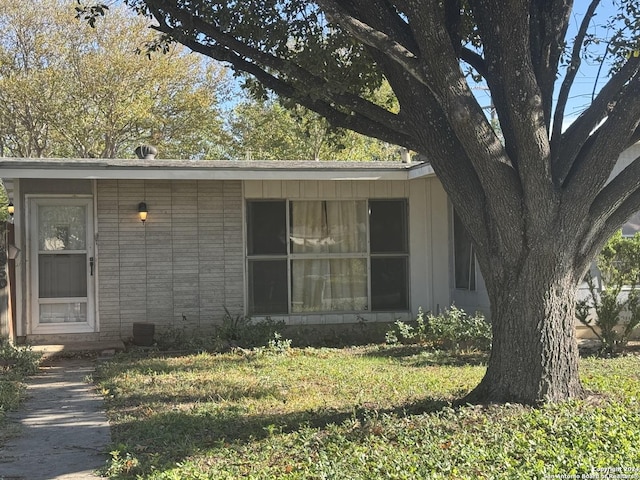 exterior space with a front lawn