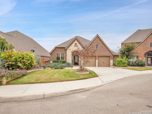 view of front facade featuring a front yard and a garage