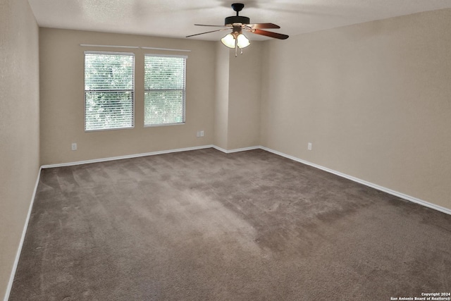 carpeted empty room with ceiling fan