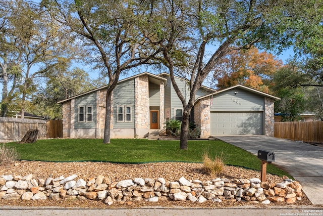 view of front of property featuring a garage and a front yard