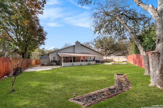 view of yard with a sunroom