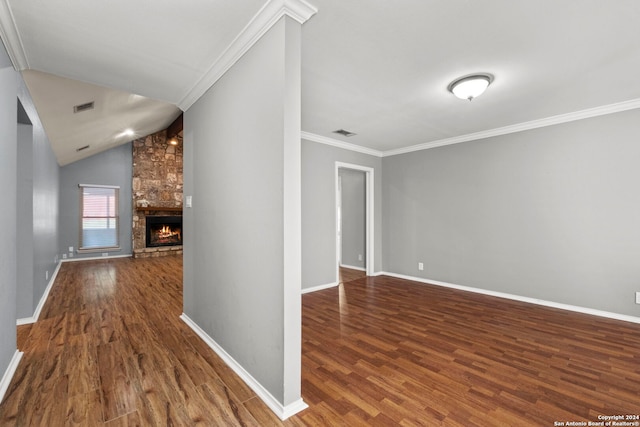 hallway featuring dark hardwood / wood-style flooring, vaulted ceiling, and ornamental molding