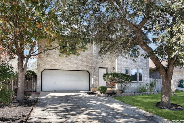 view of front facade featuring a front yard and a garage