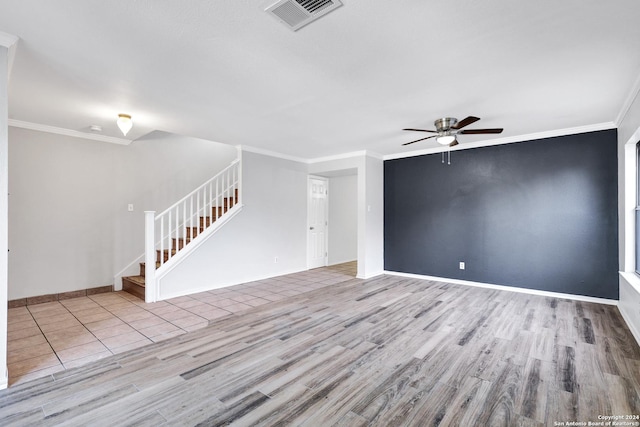 unfurnished living room featuring ceiling fan, light wood-type flooring, and ornamental molding