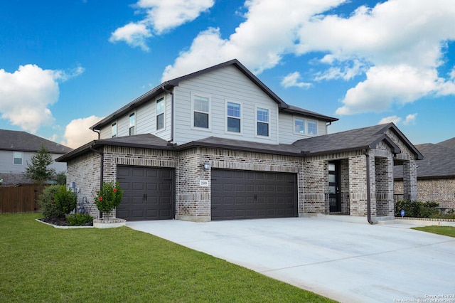 view of front of home featuring a front yard and a garage