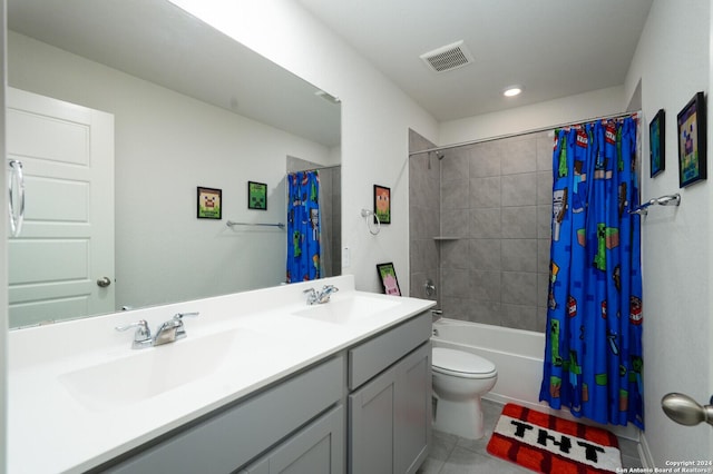 full bathroom with tile patterned flooring, vanity, shower / tub combo, and toilet