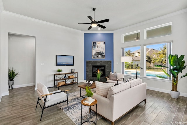 living room with ceiling fan and crown molding