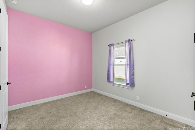 empty room featuring light colored carpet