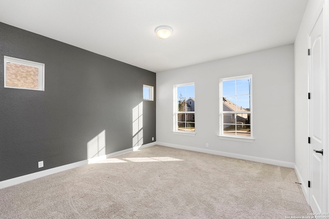 unfurnished bedroom featuring light carpet