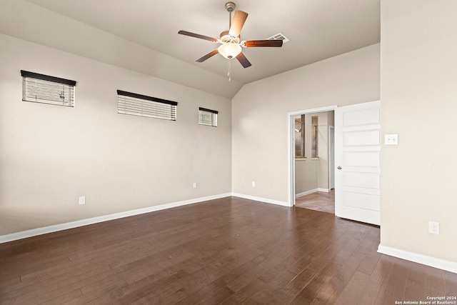 spare room featuring dark hardwood / wood-style floors, ceiling fan, and lofted ceiling