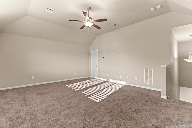 unfurnished room featuring carpet flooring, vaulted ceiling, and ceiling fan