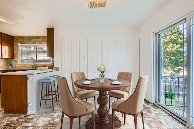 dining room featuring sink