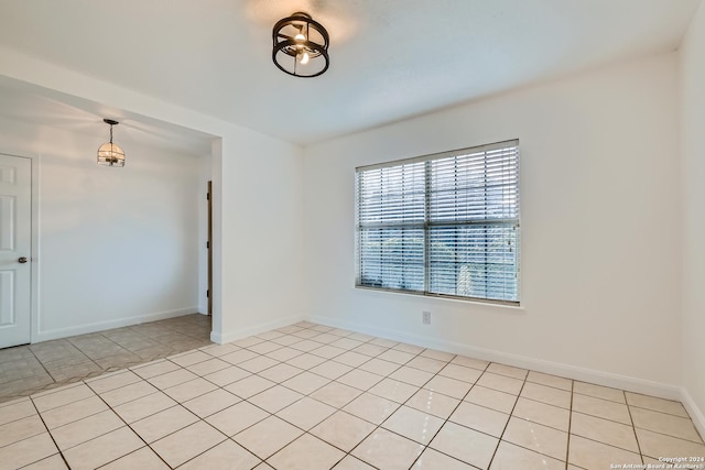 unfurnished room with light tile patterned floors