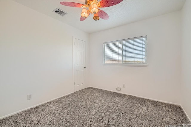 empty room with carpet and ceiling fan