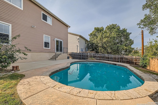 view of swimming pool featuring a patio area