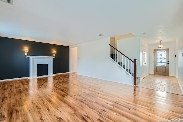 unfurnished living room with light wood-type flooring