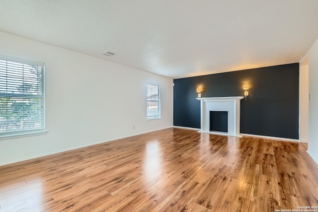 unfurnished living room featuring light hardwood / wood-style flooring