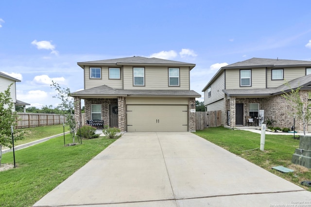 view of front of house with a front yard and a garage