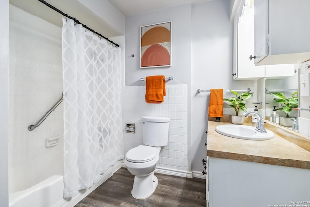 8038 Broadway Unit 225L, San Antonio, TX 78209 - bathroom with tile walls, vanity, wood finished floors, and shower / bath combo