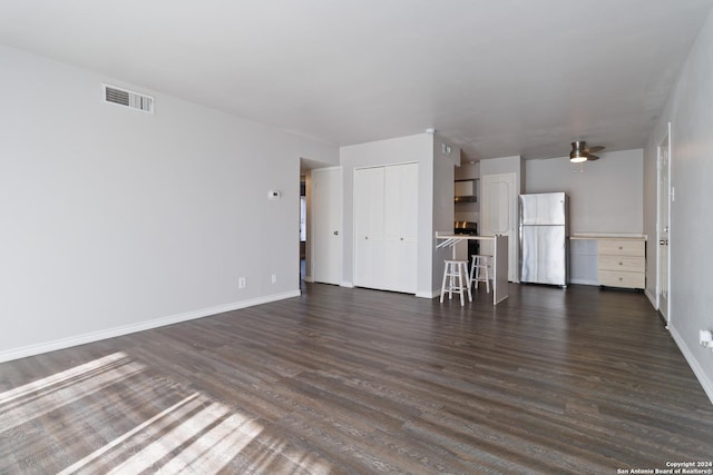 8038 Broadway Unit 225L, San Antonio, TX 78209 - unfurnished living room with dark wood-style floors, visible vents, and baseboards