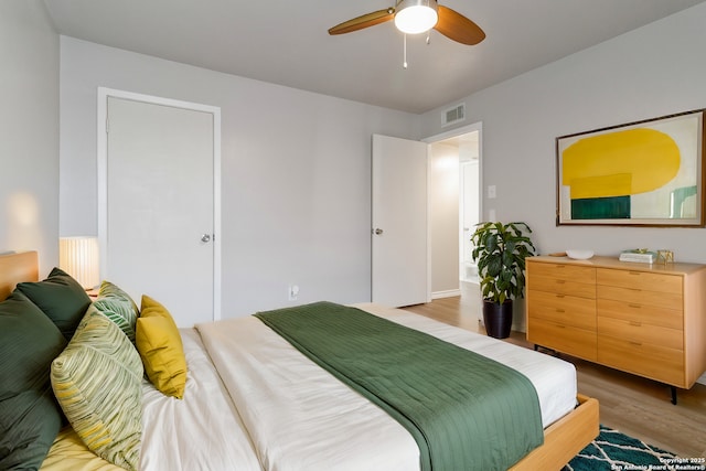 8038 Broadway Unit 225L, San Antonio, TX 78209 - bedroom featuring light wood-type flooring and a ceiling fan