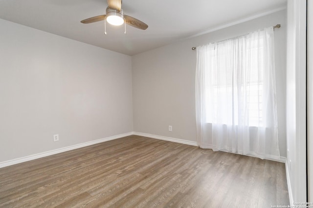 8038 Broadway Unit 225L, San Antonio, TX 78209 - empty room with baseboards, a ceiling fan, and wood finished floors