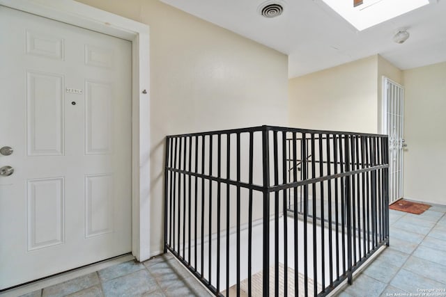 8038 Broadway Unit 225L, San Antonio, TX 78209 - stairway featuring a skylight and tile patterned flooring