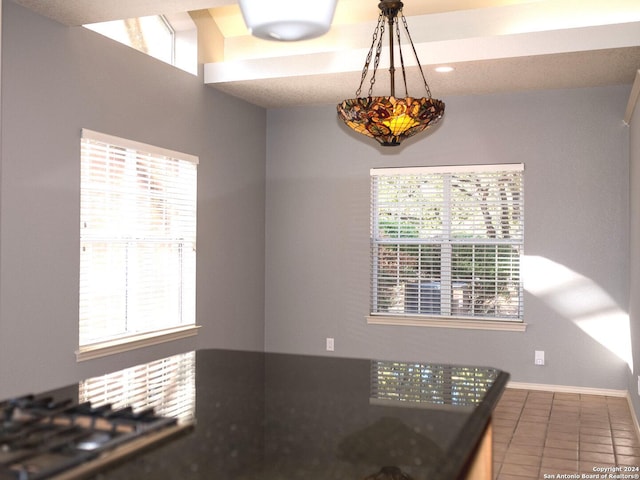 kitchen featuring pendant lighting and tile patterned floors