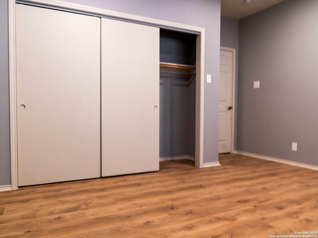 unfurnished bedroom with wood-type flooring