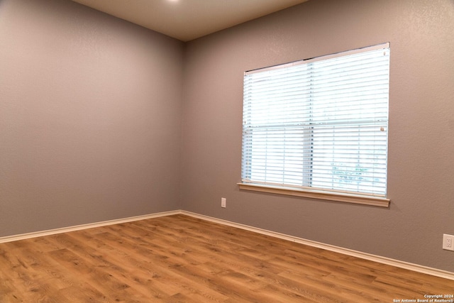 empty room featuring hardwood / wood-style flooring