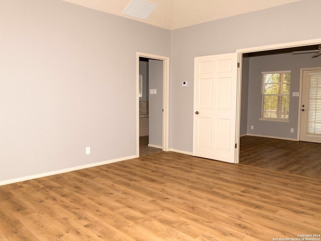 spare room featuring ceiling fan and light hardwood / wood-style floors