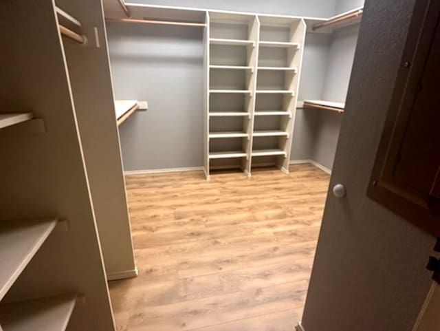 walk in closet featuring light wood-type flooring