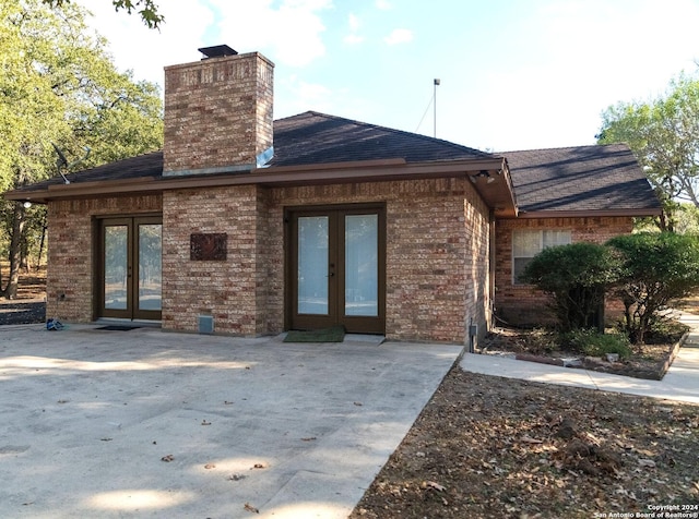 back of house with a patio area and french doors