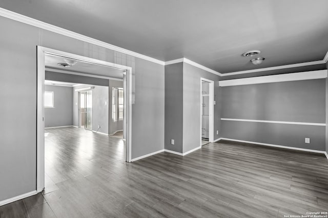 spare room with dark hardwood / wood-style floors and crown molding