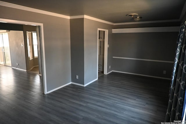 unfurnished room featuring dark wood-type flooring and ornamental molding