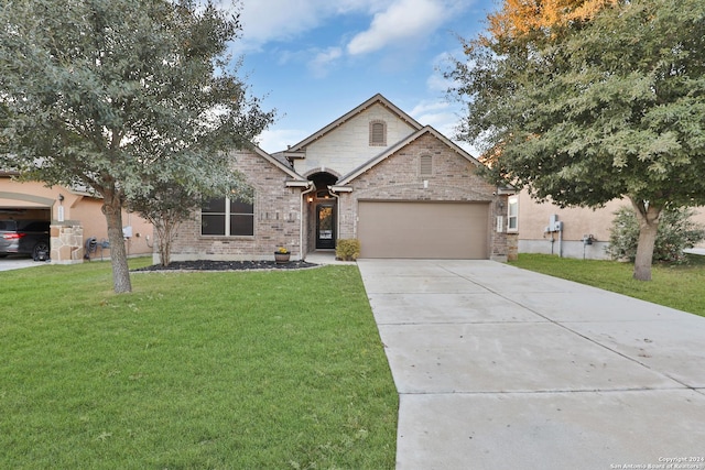 view of front of house with a front lawn and a garage